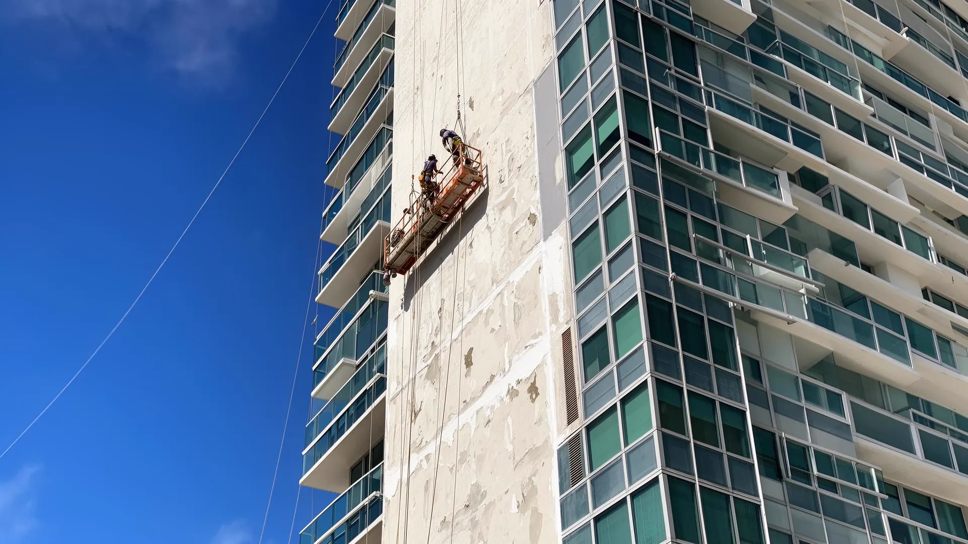 Facade restoration and exterior wall repair work on a commercial property in Golf, Florida